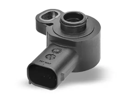 Studio shot of a precision automotive plastic sensor component as a workpiece example for AWM assembly and testing systems.